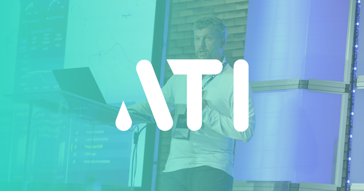 EMG Founder Brian Singleton standing on stage presenting Maven Streaming Analytics Platform